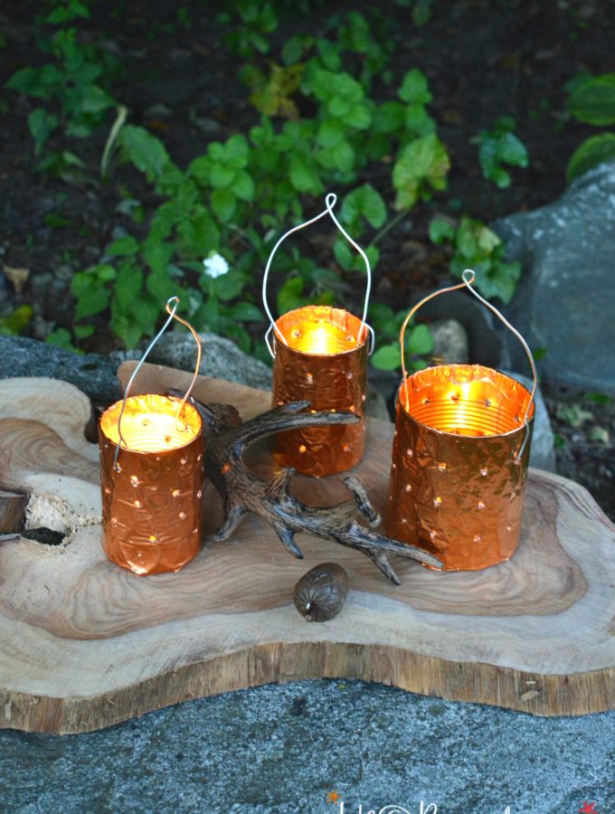 DIY copper tin can candle holders are a simple upcycle project for outdoor lighting. Make your own candle holders from cans and a drill.