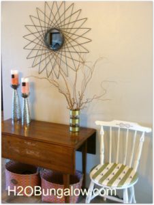 gold striped vase and chair