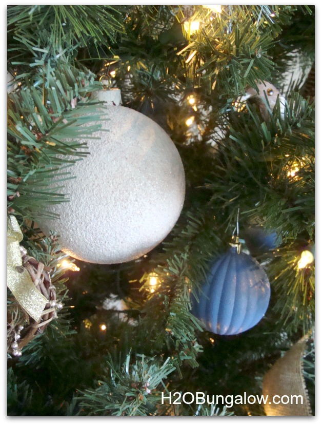 Layer ornaments from large on the inside to small on the outer branches 