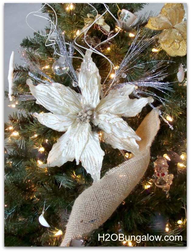 add embellishment to the focal points of the christmas tree