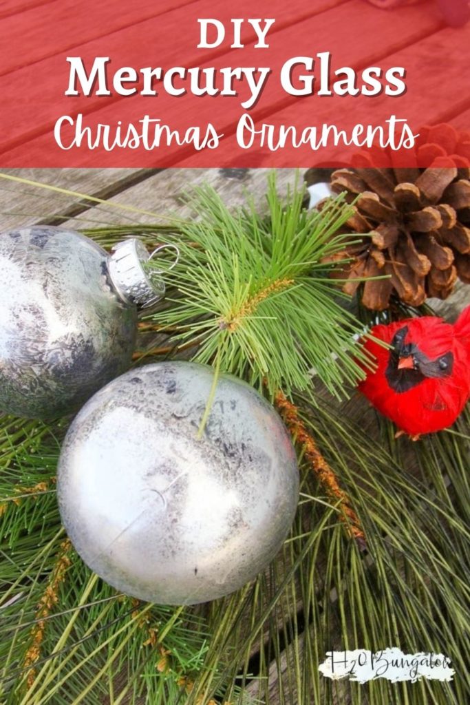 DIY mercury glass Christmas tree ornaments laying on pine tree greenery with text DIY Mercury Glass Christmas Ornaments