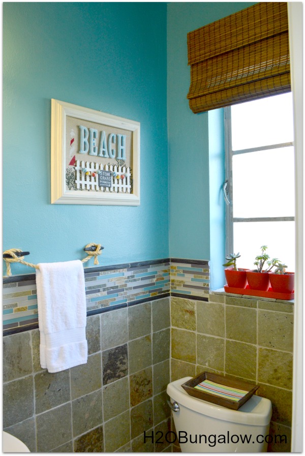 Beachy coastal bathroom makeover that is anything but boring. From the copper tissue holder to the boat cleat towel holder this bath is unique and fun. You won't believe the before! www.H2OBungalow.com
