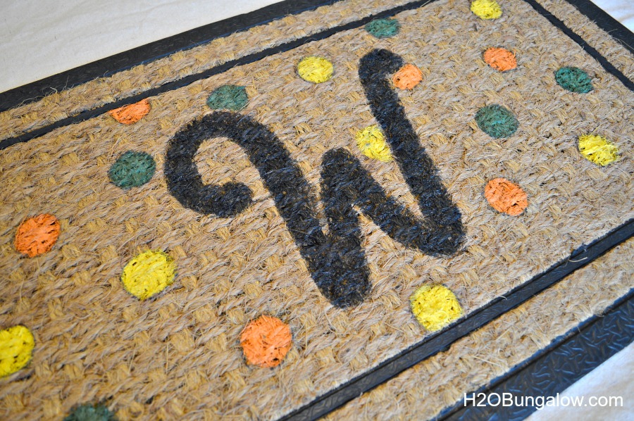 Fall doormat with monogram W on it with orange and yellow and green polka dot