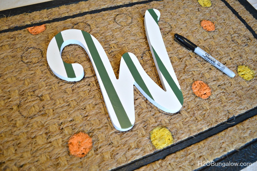 Letter W on doormat with black sharpie to trace 