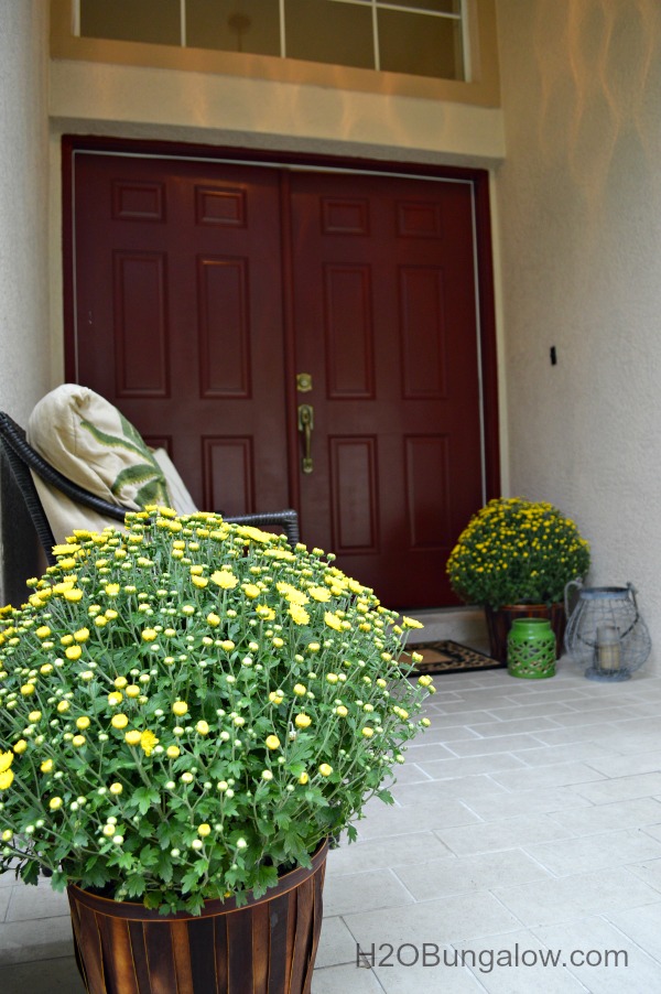 How to paint a front door, view of front entryway with welcoming decor.
