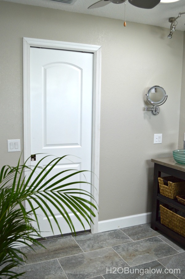 Pocket-door-in-coastal-contemporary-bathroom-makeover-H2OBungalow