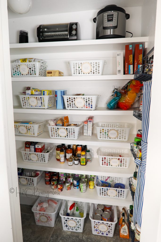 organized pantry with bins 