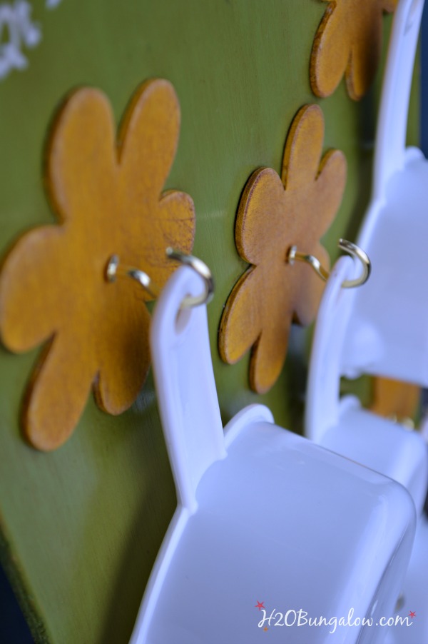 Use 3M Command Hooks to Organize Measuring Cups & Spoons Inside Cabinet.  LOVED IT…