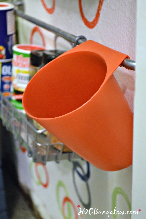 Use-cups-on-wallspice-racks-to-hold-items-and extra-spices-H2OBungalow