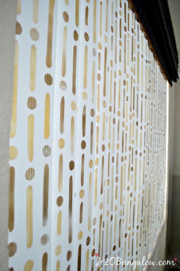 Stenciled-vertical-blinds-in-two-tone-gold-H2OBungalow