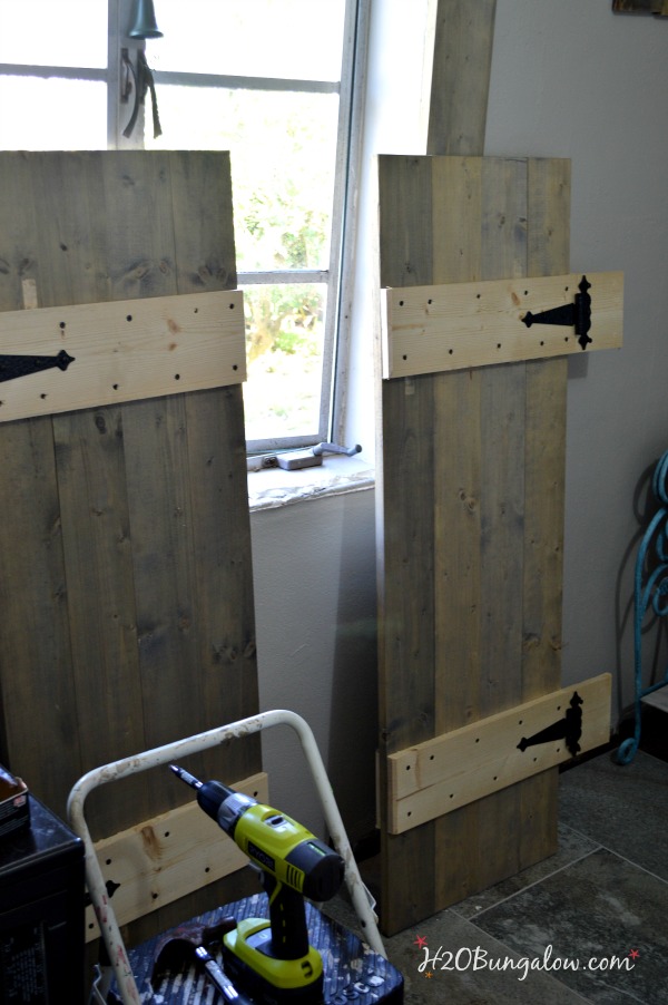 Build your own set of old world inspired wood shutters. Finish raw wood with an aging product and you have a realistic vintage appeal on a DIY budget! Good tutorial. www.H2OBungalow.com #woodworking #powertoolproject