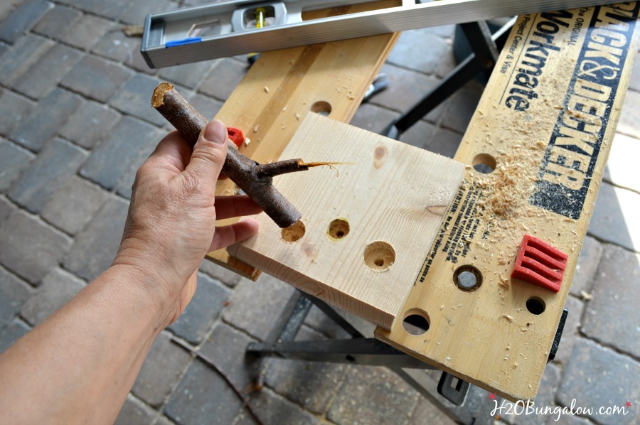 Fitting-branches-on-to-twig-coat-rack-H2OBungalow