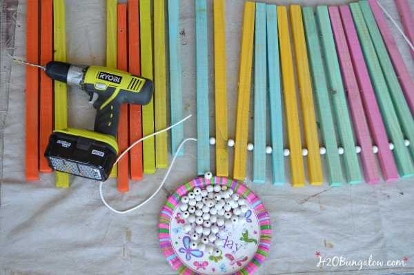 string beads in between slats on wood doormat H2OBungalow