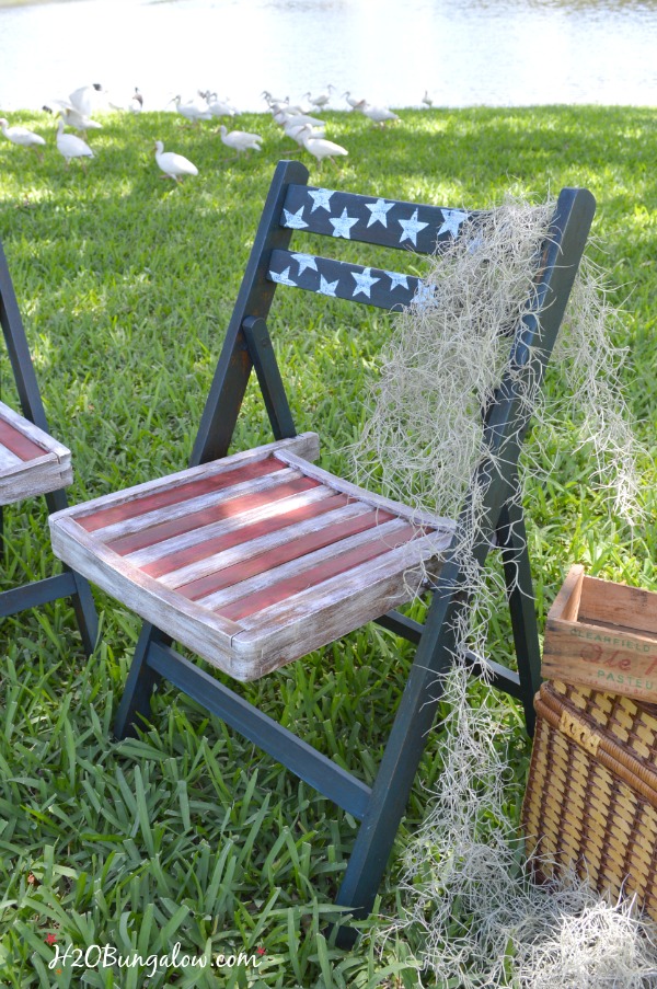 Red white and blue DIY patriotic folding chais painted and decoupaged by H2OBungalow See this project and many more fun patriotic themed projects in our themed tour 