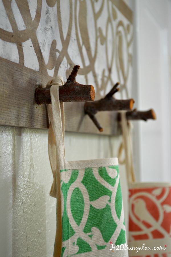 Organize a front entry with a fun and unique coat rack made with tree branches. H2OBungalow