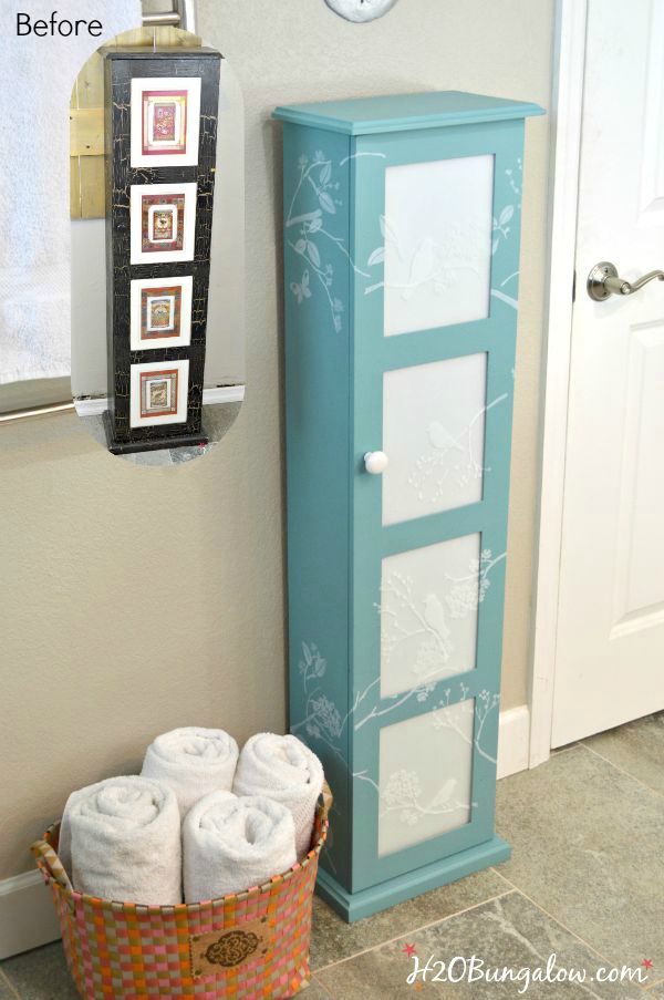 Updated bath storage cabinet with DIY frosted glass inserts and cascading stenciled birds and twigs. It looks fresh and clean look in our new master bath www.H2OBungalw.com #ThemedFurnitureMakeoverDay #painted