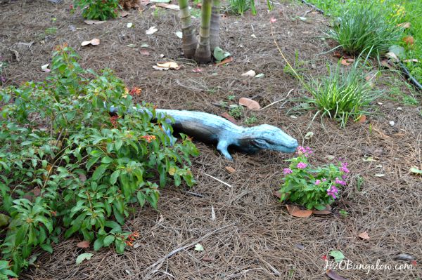 Faux painted bronze garden statue adds character to any garden spot without breaking the bank! Simple project any can do H2OBungalow.com #faux #garden #yardart