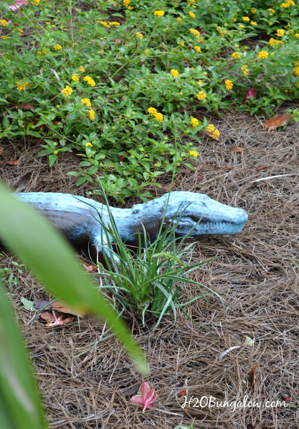 A DIY faux painted bronze garden statue was easy to make in a few hours, took little to no special skill and looks just like the big budget bronze statues that cost hundreds of dollars. See how in this easy tutorial by H2OBungalow.com #fauxpaint #yardart #gardendecor