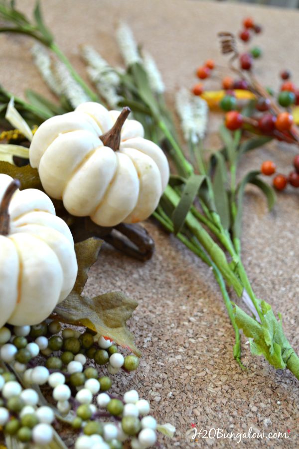 Make a simple and festive monogram fall wreath with starfish, acorns and pumkins. Tuck sprigs of greenery into the grapevine wreath for filler. See this and 30 more fall projects in the Fall Ideas Tour. www.H2OBungalow.com #Fallwreath "Falldecor #FallIdeasTour