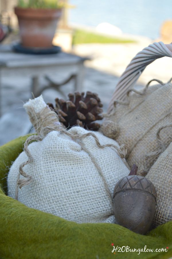 Simple no sew burlap pumpkin tutorial. Whip these darling pumpkins up in no time at all, use as a table decoration, as name tags for place settings or fill a basket for an entryway seasonal vignette. www.H2OBungalow.com #pumpkin #falldecor