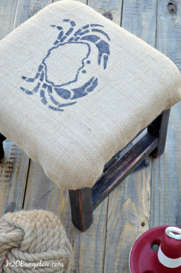 DIY coastal burlap footstool with crab graphic. Easy tutorial to cushion something in burlap and add a graphic. Linked to Themed Furniture Makeover Day and many more black furniture makeovers www.H2OBungalow.com #paintedfurniture