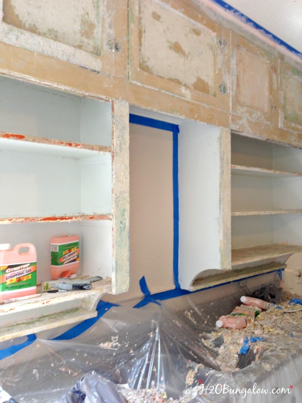 multiple-layers-of-paint-to-be-stripped-on-kitchen-cabinets-H2OBungalow