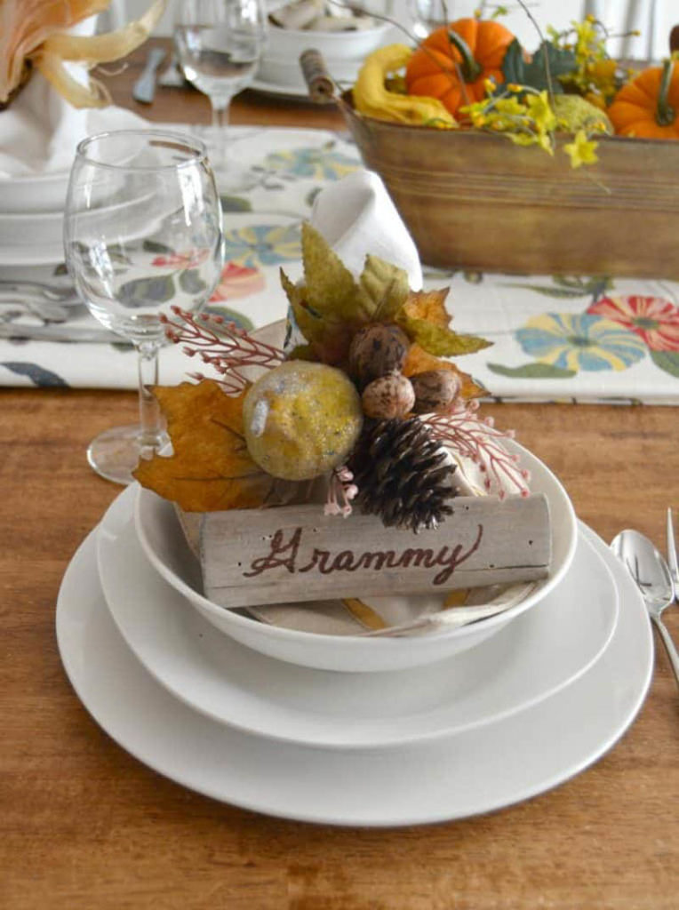 place setting with fall floral spray and wooden place card holder that says grammy