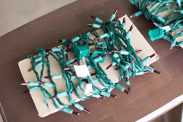 Christmas tree lights wrapped around cardboard