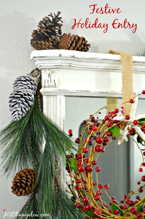 My festive holiday entry makes good use of an entry table in a tight space to stage a warm welcome with a multi-purpose vignette, Christmas cards hang nicely on the metal ladder and a bucket of lap blankets are perfect for a chilly night add to a pretty entry with simple decor. www.H2OBungalow.com #Smallspace 