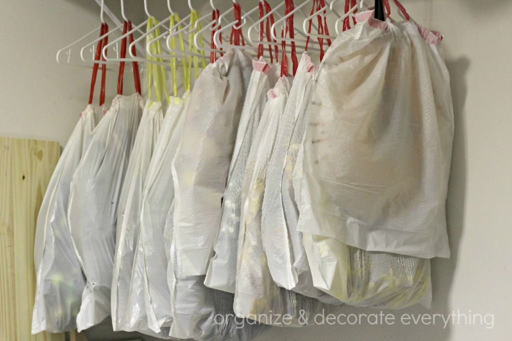 Wreaths hanging on hangers in trash bags