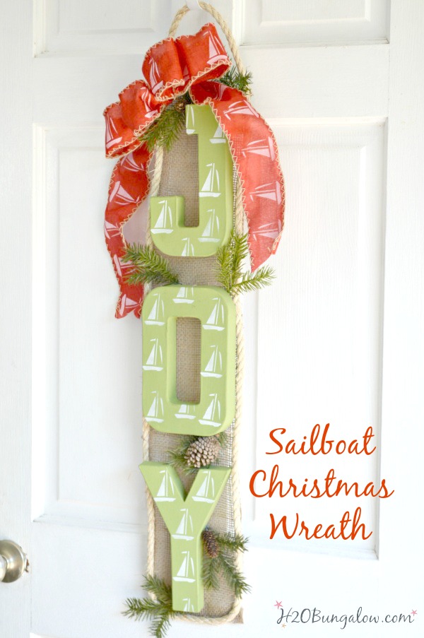 Nautical sailboat Christmas wreath puts a new twist on a coastal themed wreath for the holidays. I love indoor or on the front door! H2OBungalow