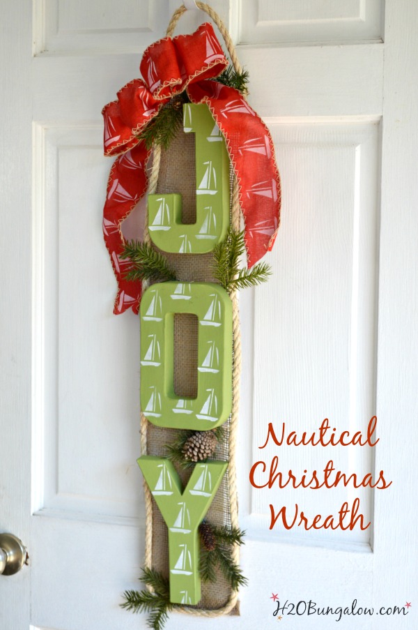 Nautical sailboat Christmas wreath puts a new twist on a coastal themed wreath for the holidays. I love indoor or on the front door! H2OBungalow
