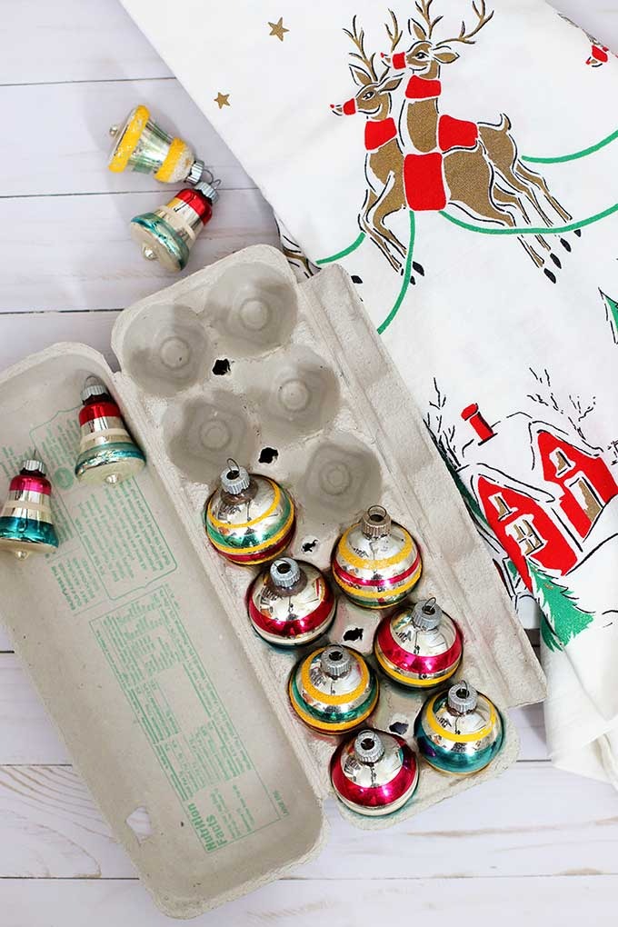 Organize and pack Christmas decorations using cardboard egg cartons