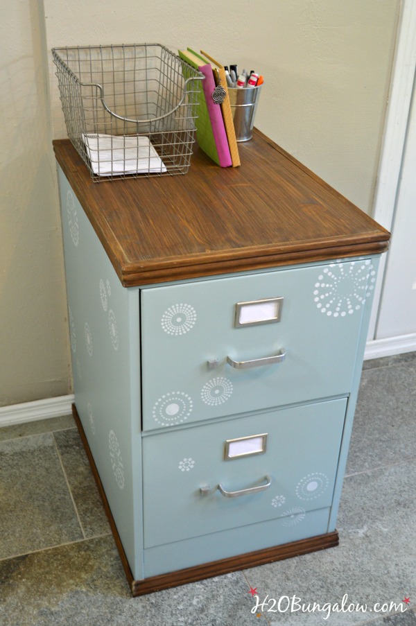 Use a thrift store cast off for this project. DIY tutorial for upcycled painted and stenciled filing cabinet makeover with stained wood top and bottom. Add style to your office a budget. H2OBunglow.com 