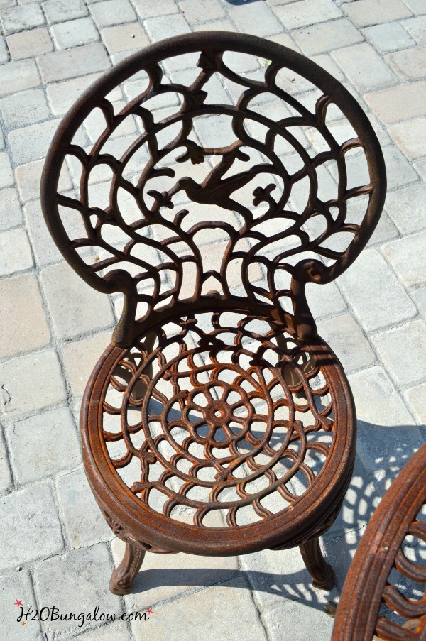 rusted outdoor metal chair before paint makeover