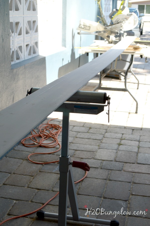 Stand to hold long baseboard pieces when cutting 