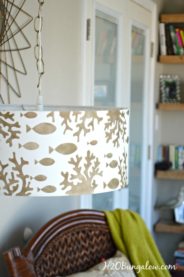 Tutorial to show how to make a simple stenciled DIY hanging pendant light from a drum lampshade, a chain and a light conversion kit. Easy DIY.