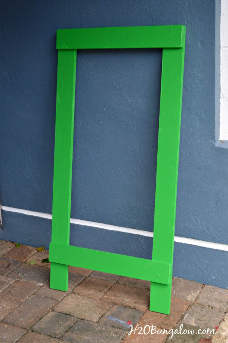 assembled frame of DIY football toss game painted green