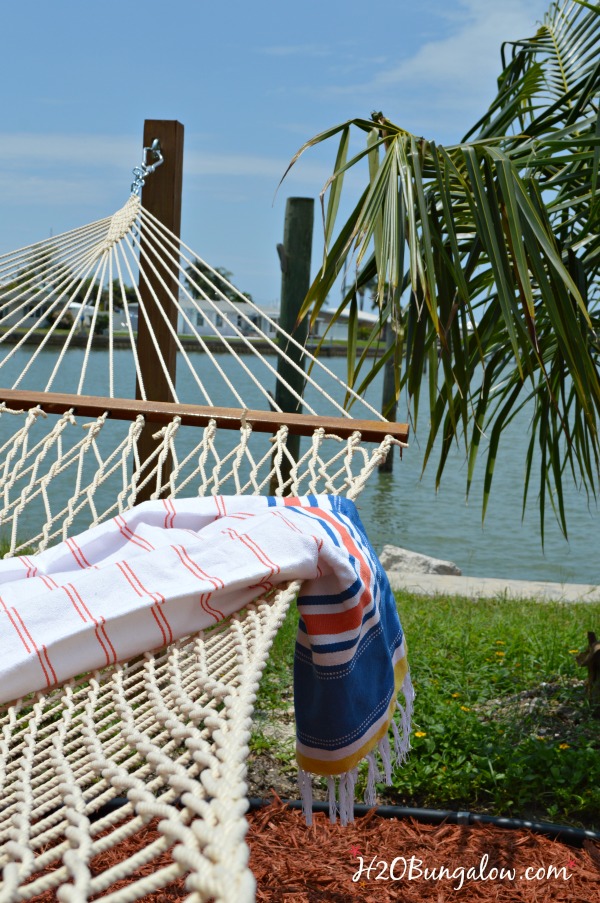 striped summer throw on hammock facing the ocean view