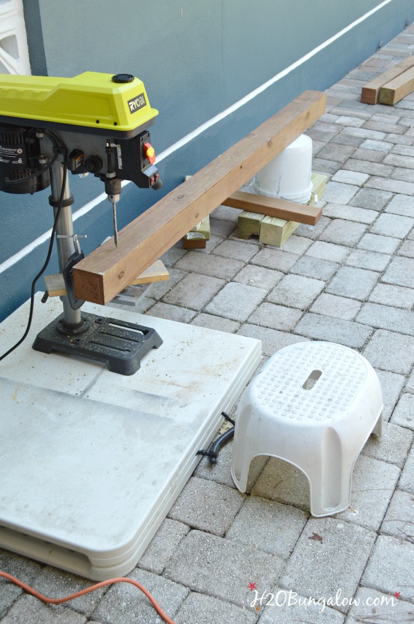 Drilling holes in the pole for the DIY hammock stand