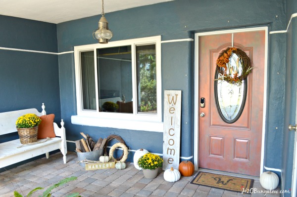 Front porch with bench, yellow mums, pumpkins and DIY large wood welcome sign