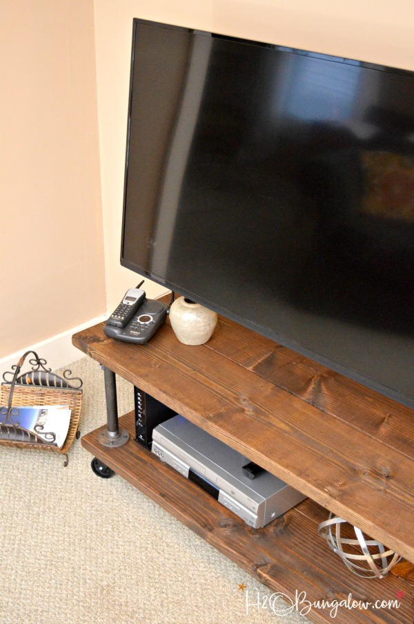 Tutorial to make a DIY industrial style media stand with wheels. Simple step directions for an upscale industrial cart style tv stand. Easy build project. 