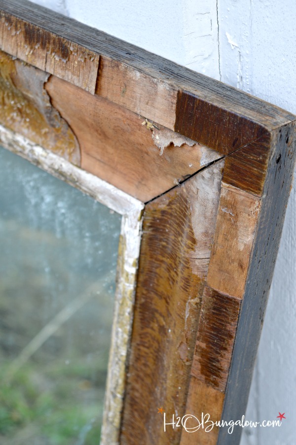 Get the Restoration Hardware look for less. Tutorial to remove veneer from wood on an old mirror exposing a natural wood patina and deconstructed style.