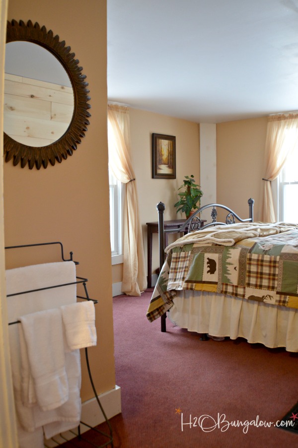 diy planked wall shown in bedroom at the lodge