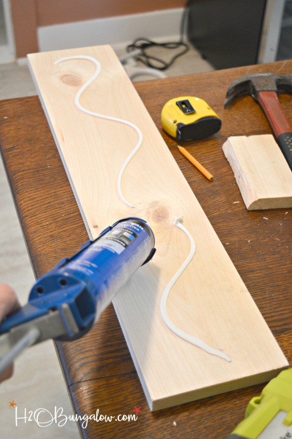 wood glue being put on plank