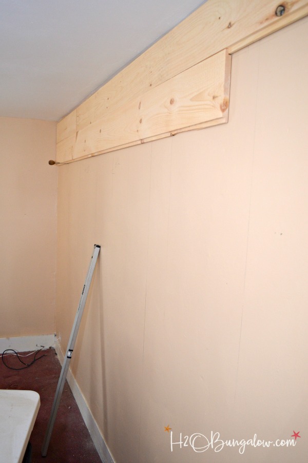 wood plank wall being installed