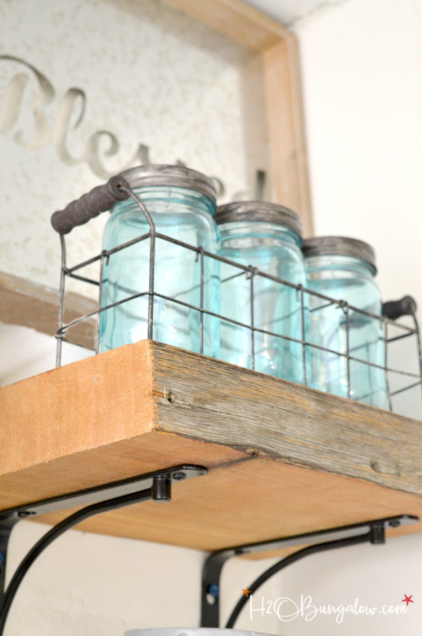 DIY reclaimed wood kitchen shelves made from wood scraps add character and texture to a modern farmhouse. Simple tips for an upscale DIY kitchen project 