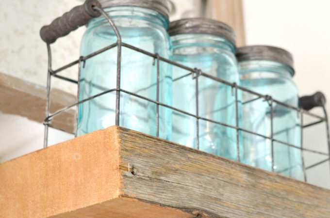 DIY reclaimed wood kitchen shelves made from wood scraps add character and texture to a modern farmhouse. Simple tips for an upscale DIY kitchen project