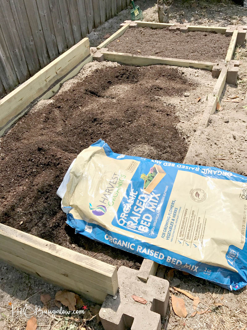 raised garden bed with organic soil bag 