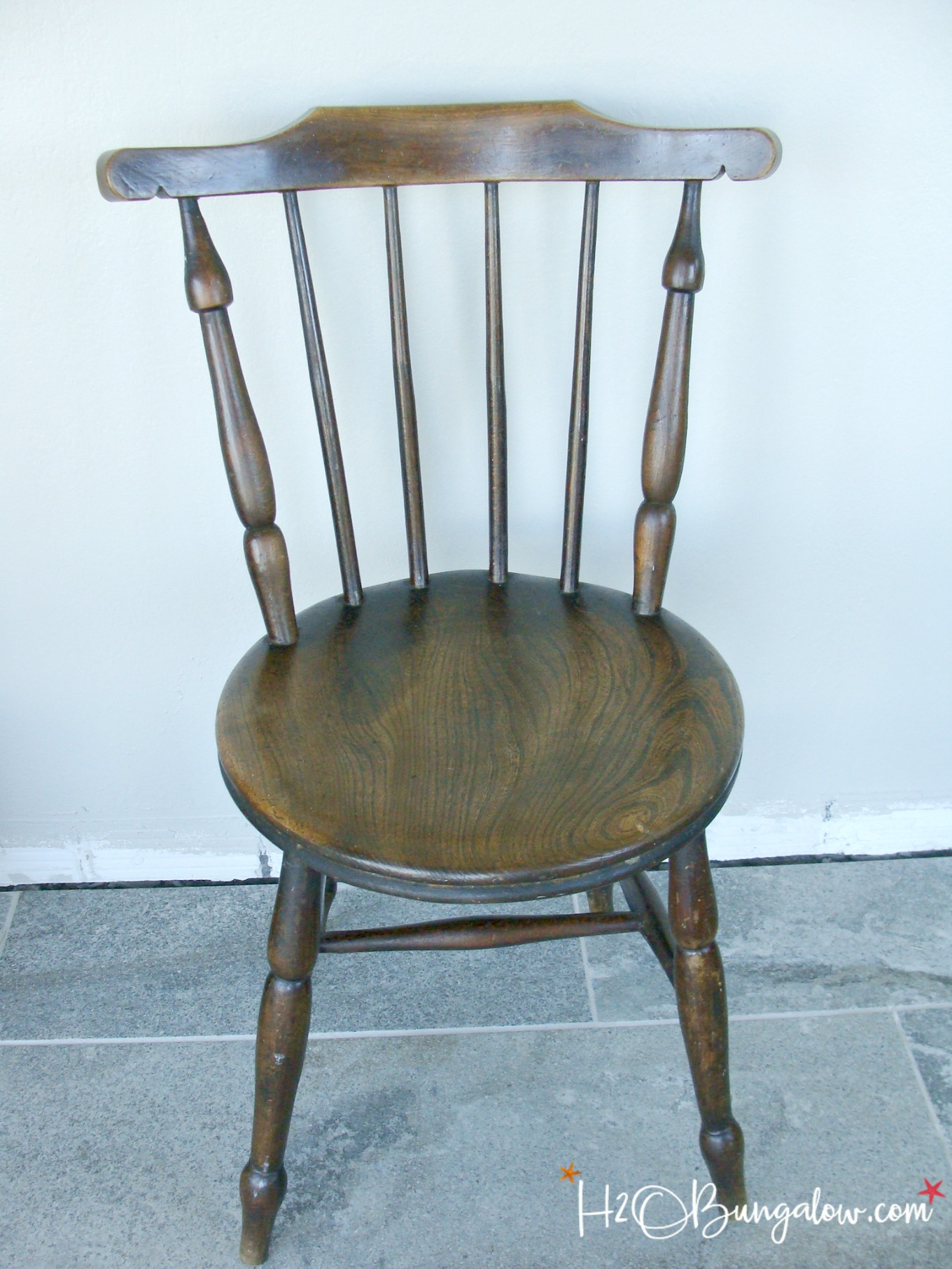 Make a DIY nautical accent chair that looks like it came from a vintage designer with a paint and a stencil for the perfect sailboat coastal chair makeover. 